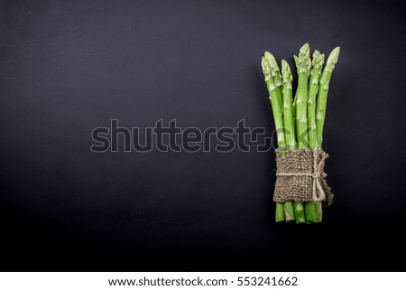 Bunch of asparagus over slate background