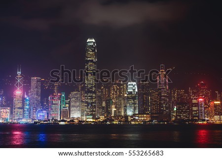 Beautiful vibrant night View of Hong Kong skyline, Victoria Bay harbor, with skyscrapers and 