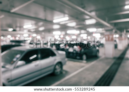 Blur picture car parking in department store .Vintage filter color effect
