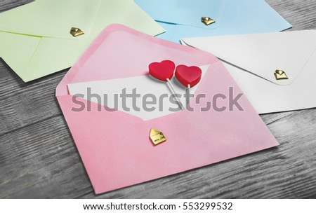 Valentines Day Envelope Mail, Red Heart. Valentine Letter Card, Wedding Love Concept in colorful letters envelopes. Gold seal with hearts valentine envelopes. Light Vintage white wood background.