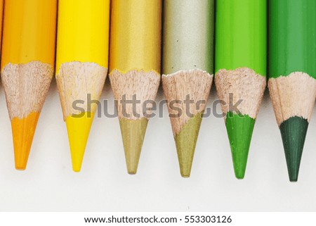Colored pencils on white background