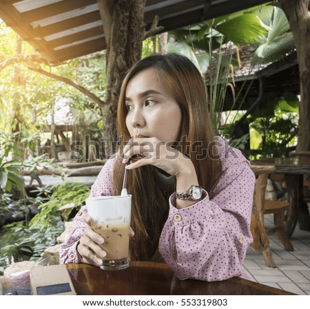 asian woman drinking coffee in the morning at restaurant