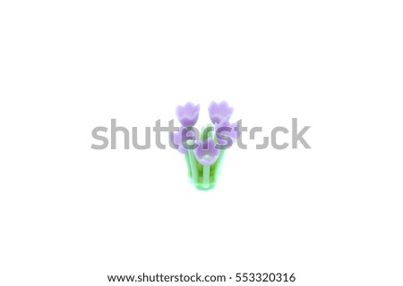 Little toy flower on isolated background