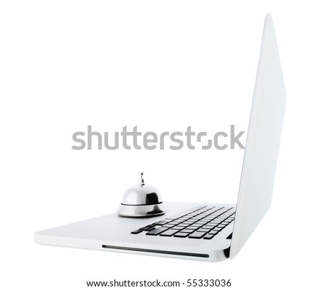 Side view of the aluminum laptop and a silver bell