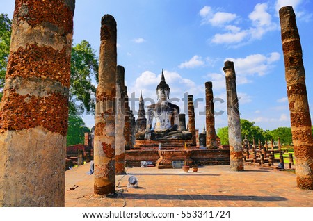 Scenic View Ancient Meditating Buddha Statue in The Sacred Buddhist Temple Ruins of Wat Mahathat in The Sukhothai Historical Park, Thailand