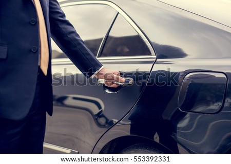 Businessman Handle Limousine Door Car Royalty-Free Stock Photo #553392331
