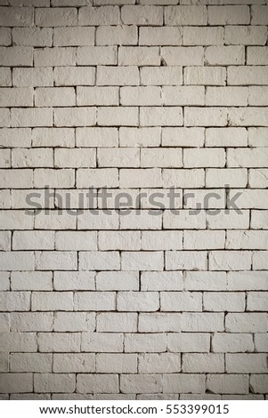 White brick wall for texture or background,with vignette and vintage toned style