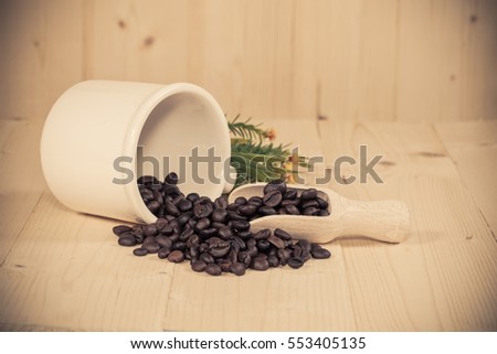 Fresh coffee bean and wood spoon