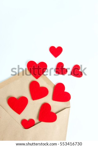 Red hearts pours out of the envelope. White background.