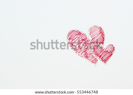 Hand drawn 2 hearts on white paper blur focus