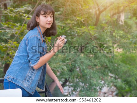 portrait of the happy young woman with the camera