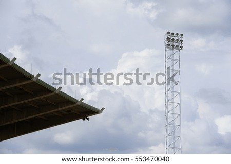 Stadium lights and blue sky