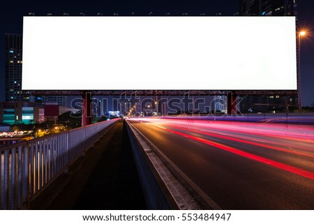 Blank billboard on light trails, street and urban in the night - can advertisement for display or montage product or business.