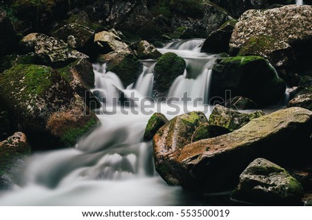 Waterfall of a stream in a valley