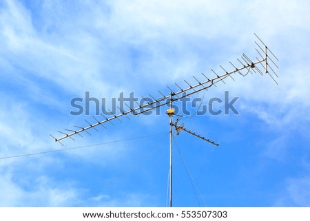 television antenna with blue sky background.