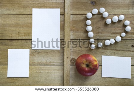still life for Valentine's Day with apple, sweet heart and letter 5