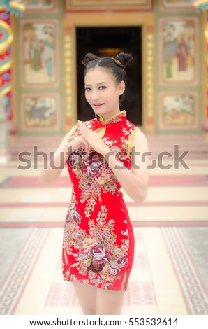 happy Chinese new year. Asian girl with gesture of congratulation