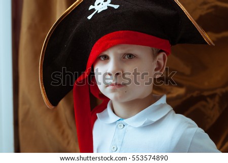 a young pirate in a black hat, pirate logo, the Jolly Roger, Mardi Gras