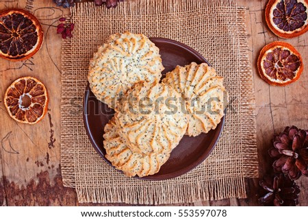 Cookies, poppy; tasty sweet food on a wooden background