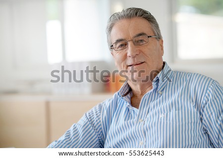 Portrait of senior man in office