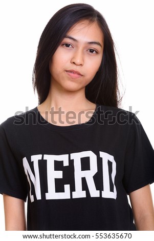 Close up of young Asian teenage nerd girl isolated against white background