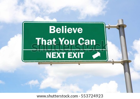 Green overhead road sign with a Believe That You Can Next Exit concept against a partly cloudy sky background.