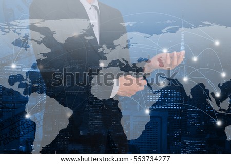 Double exposure business and on world map and network line communication. Global buses concept. Elements of this image furnished by NASA