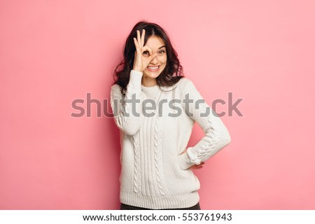 Young cheerful girl showing zero gesture.