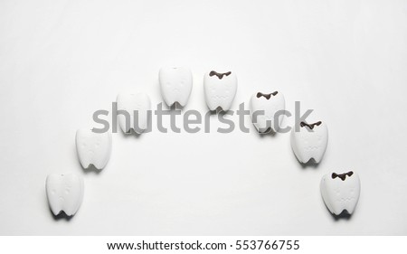 Curve of Decayed tooth model and some tooth start to decayed tooth, Curve like feeling sad mouth