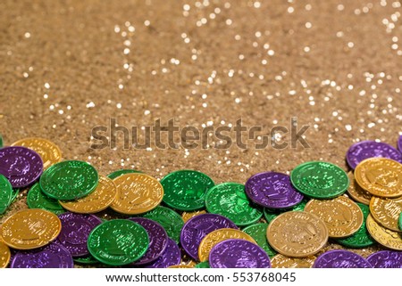 Mardi Gras Coins on Gold Glitter