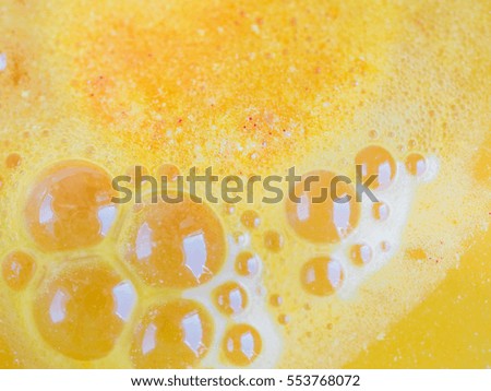 Abstract orange foam of effervescent water