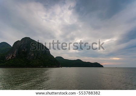 Sunrise on Island in the Sea with Cloudy Sky.