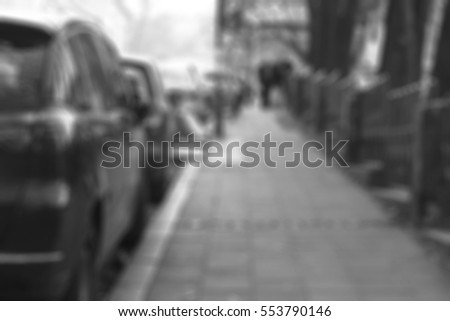 blurred backgrounds streets with parked cars black and white