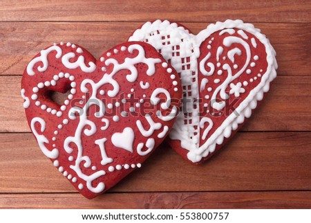 Two heart gingerbread red and white icing cookies I love you