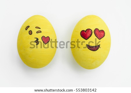 Painted emoji Easter eggs in different moods and facial expressions such as kissing, smiling or being in love, in isolated white background.