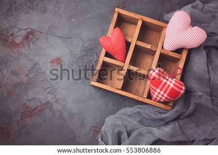 Valentines day background with heart shapes in wooden box. View from above
