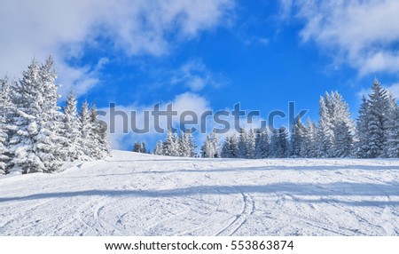 mountain ski slope on a sunny day. Winter mountain landscape