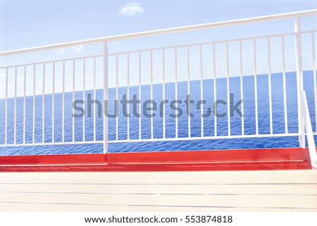 Outside floor with shiny look, weather is clear, daytime scene with sunlight, sea area is shinning, perfect lighting of photo, fence is white color