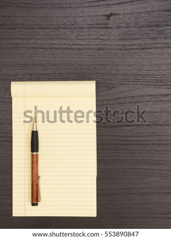 Wood Desk, Yellow Notepad,Ballpoint Pen