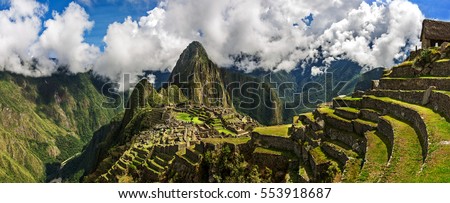 Picturesque panoramic view of terraces of Machu Picchu. Royalty-Free Stock Photo #553918687