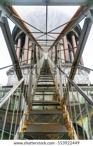 Metal stairs between towers in Saint Petersburg. Steel constructions of the bridge. Metal constructions. Architectural pattern. Natural design.