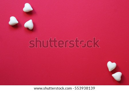 Valentines day composition. Hearts on red background. Top view. Flat lay. Copy space