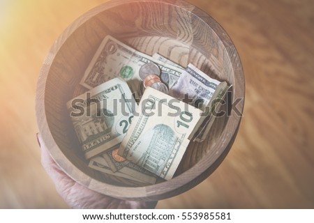 Church Collection Bowl Fundraising Royalty-Free Stock Photo #553985581