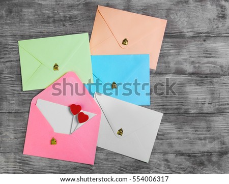 Valentines Day Envelope Mail, Red Heart. Valentine Letter Card, Wedding Love Concept in colorful letters envelopes. Gold seal with hearts valentine envelopes. Vintage white wood background. Top view