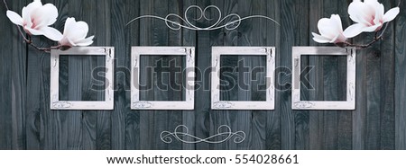 Banner with set of photo frames, white magnolia flowers and ornament on background of shabby wooden planks. Copy space. 