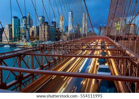 View of Brooklyn Bridge at night with car traffic night Brooklyn Bridge