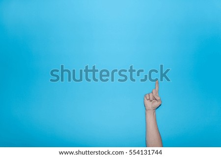 Finger symbol isolated on blue background ,Gesturing 1

