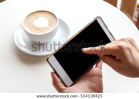 Taking photograph of coffee by smartphone