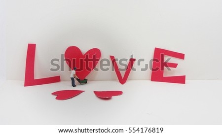 miniature carrying gift boxes.Valentine day concept background.Vintage color toned.