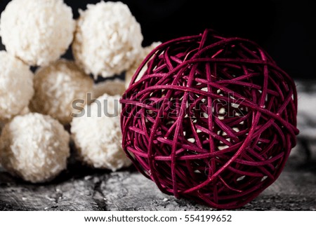 Candy with coconut and nuts on scratched background. Sweets